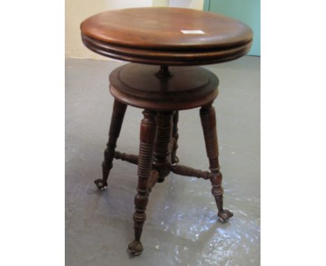 Edwardian beech adjustable piano stool on metal and glass claw feet.(B.P. 24% incl. VAT)