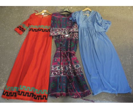 Three 1970s vintage ladies maxidresses to include; a red woollen dress with green and black Greek key detail by Susan Small, 