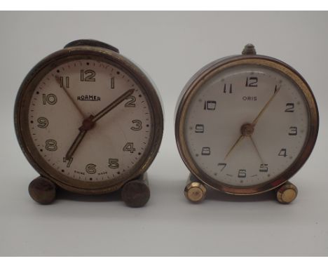 Two vintage alarm clocks, Oris and Roamer