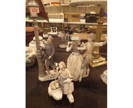 Three pieces of Lladro, girl on scooter, gentleman with lamp post and dancers, all at minor fault 