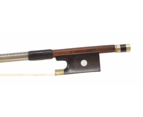 Nickel mounted violin bow bearing an illegible stamp, the stick round, the ebony frog inlaid with pearl eyes and the ebony ad