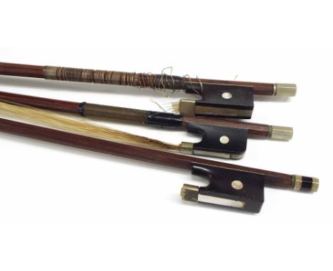 Two French nickel mounted violin bows, one stamped Pillot; also a half size nickel mounted violin bow (3)