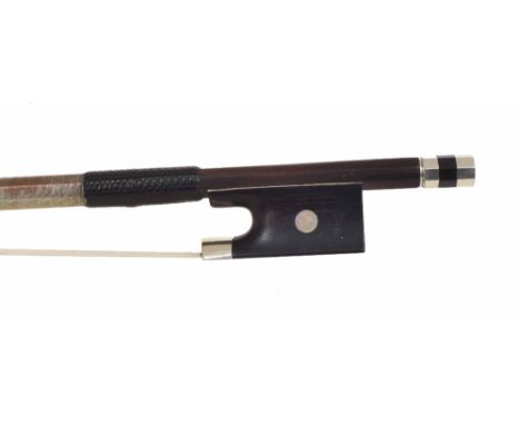 Silver mounted violin bow stamped A. Lamy á Paris, the stick round, the ebony frog inlaid with pearl eyes and the ebony adjus