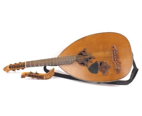 Early 20th century Theorbo lute, converted to a six string lute guitar, with multi-section bowl back, spruce top with carved 