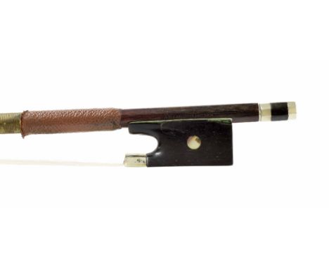 German violin bow by and stamped Arthur Thoma, the stick round, the ebony frog inlaid with pearl eyes and the ebony adjuster 