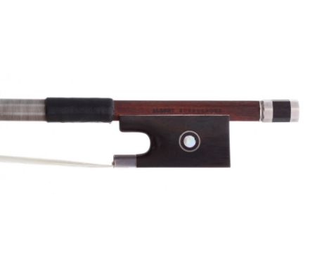 German silver mounted violin bow stamped Albert Nurnberger, the stick round, the ebony frog inlaid with silver rings enclosin