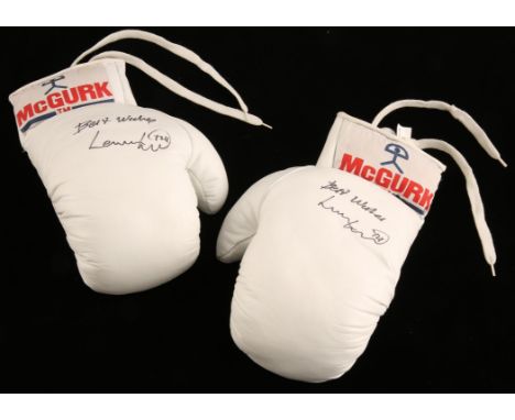 Signed Lennox Lewis McGurk Boxing Boxing Gloves - Pair of White gloves, both signed in black pen 'Best wished Lennox Lewis'. 