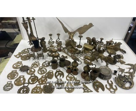 A LARGE COLLECTION OF BRASSWARE INCLUDING, ANIMALS, HORSEBRASS, FIRESIDE TOOLS, BELLS AND CANDLE HOLDERS 