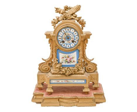 A French spelter gilt mantle clock, late 19th c, in Louis XVI style, inset with blue celeste ground porcelain dial and panels