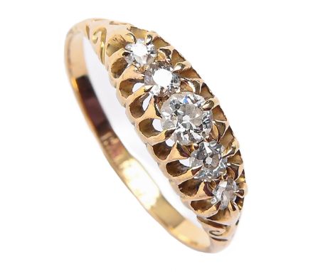 A diamond five stone ring, with old cut diamonds, in gold marked 18ct, 2.6g, size P  Light wear