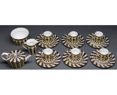 An E J D Bodley bone china tea service, c1880, the striped cobalt and primrose ground decorated with gilt tendrils, the servi