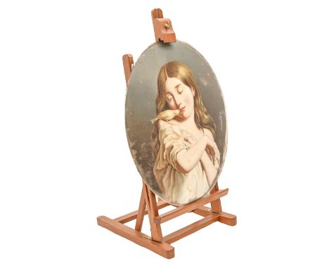An oval crystoleum of a young girl and canary, convex glass, 46cm, unframed, on modern wood easel  