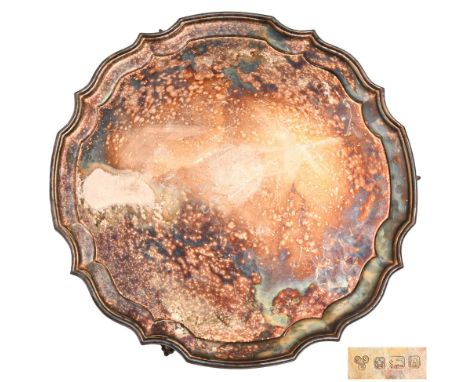 An Elizabeth II silver salver, on three leaf capped feet, 35.5cm diam, by Sterling Silverware Ltd, Sheffield 1976, 38ozs 8dwt