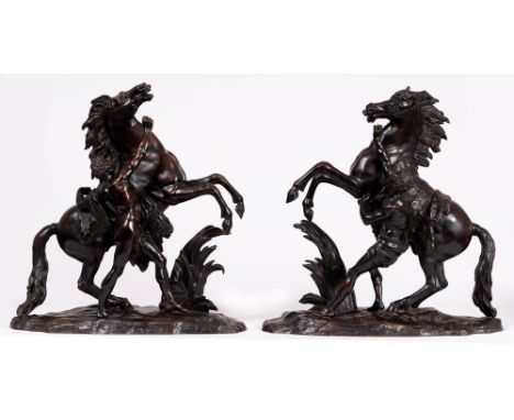 A pair of French bronze sculptures of the Marly Horses after the statues by Guillaume Coustou, late 19th/early 20th century, 