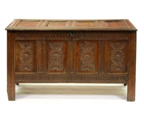 A Charles II oak chest,&nbsp; with four panel lid, the conforming front with nulled frieze and rail flanking four guilloche c