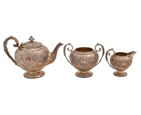 A Scottish Victorian silver tea service, each piece of globular shape and with a wide repousse strapwork band, festoons and b