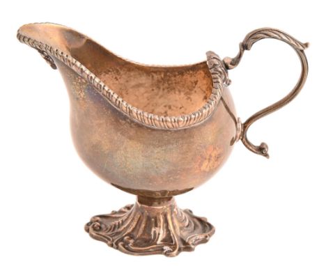 An Edwardian silver sauceboat, in George II style, with gadrooned rim and leaf capped handle, 10.5cm h, by D &amp; M Davis, B