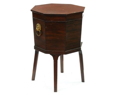 A George III mahogany octagonal wine cooler, with zinc liner, brass lion mask handles, on square legs, 72cm h; 48cm w  Top su