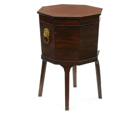 A George III mahogany octagonal wine cooler, with zinc liner, brass lion mask handles, on square legs, 72cm h; 48cm w  Top su