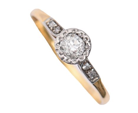 A diamond ring, illusion set between diamond shoulders, gold hoop marked 750, 2.2g, size O  Light wear