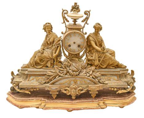 A French giltmetal mantel clock, late 19th c, in Louis XVI style, the drum cased movement with alabaster dial and urn finial 