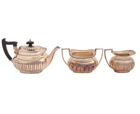 An Edwardian silver bachelors tea service, teapot 11.5cm h, by Walker &amp; Hall, Sheffield 1903 and 04, 23ozs 10dwts  Marks 