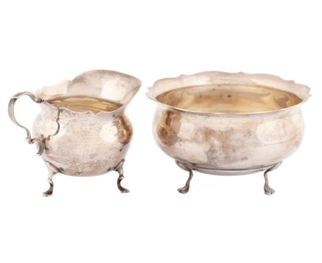 A George V silver sugar bowl, 11cm diam, part marked, Birmingham 1913 and a similar cream jug, London 1906, 6ozs 9dwts (2) Li