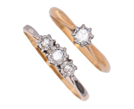 A diamond solitaire ring and a diamond three stone ring, each with gold hoop marked 18ct PLAT, 3.4g, size H and N  Light wear