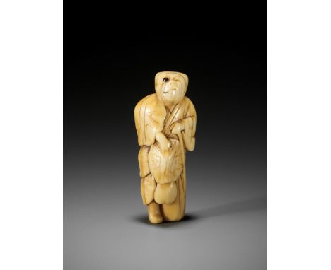 A RARE MARINE IVORY NETSUKE OF A TANUKI IN MID-TRANSFORMATIONUnsigned Japan, 18th century, Edo period (1615-1868)The mischiev