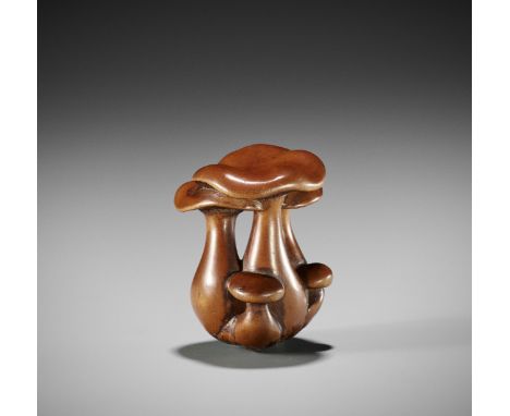 A WOOD NETSUKE OF A CLUSTER OF SHIMEJI MUSHROOMSUnsigned Japan, 19th century, Edo period (1615-1868)Finely carved, partially 