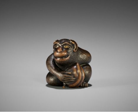 TOYOKAZU: A SUPERB WOOD NETSUKE OF A MONKEY WITH PEACHBy Shugasai Toyokazu, signed Toyokazu 豊一Japan, Sasayama, Tanba province