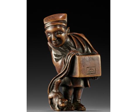 IKKEI: A RARE WOOD NETSUKE OF A STREET PERFORMER WITH WEASEL  By Ikkei, signed Ikkei 一圣Japan, Edo (Tokyo), c. 1800, Edo perio