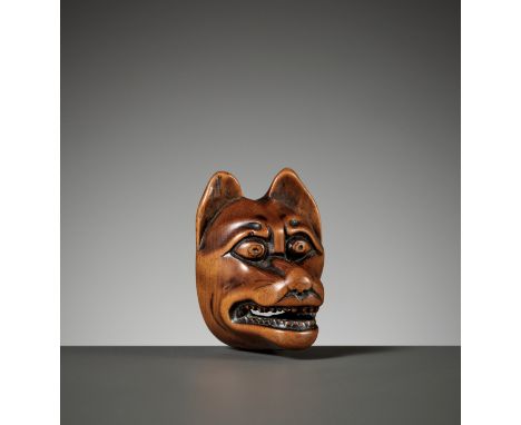 A FINE WOOD MASK NETSUKE OF KITSUNEUnsigned Japan, 19th century, Edo period (1615-1868)Well carved as a kitsune (fox) mask wi