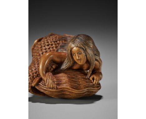 HIDEHARU: A SUPERB WOOD NETSUKE DEPICTING A MERMAID CAUGHT IN A GIANT HAMAGURIBy Hideharu, signed Hideharu 秀晴Japan, Nagoya, l