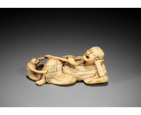 A RARE AND LARGE IVORY NETSUKE OF A RECLINING SARUMAWASHI AND HIS MONKEYUnsignedJapan, early 18th century, Edo period (1615-1