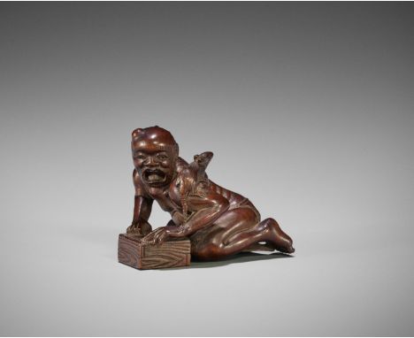 A WOOD NETSUKE OF A FRUSTRATED RAT CATCHERUnsignedJapan, 19th century, Edo period (1615-1868)The emaciated rat catcher with a