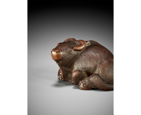 MASAYUKI: A FINE NAGOYA SCHOOL WOOD NETSUKE OF RECUMBENT OXBy Masayuki, signed Masayuki 正行 to 刀Japan, Nagoya, mid-19th centur