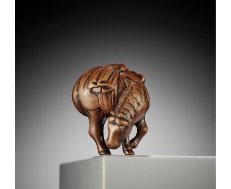 A GOOD WOOD NETSUKE OF A GRAZING HORSE  UnsignedJapan, 18th century, Edo period (1615-1868)The classic 18th-century model int