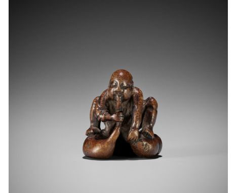 A RARE BAMBOO NETSUKE OF AN INEBRIATED MONKUnsignedJapan, 18th century, Edo period (1615-1868)The monk wearing a half-shoulde