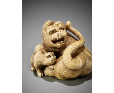 RANICHI: A SUPERB IVORY NETSUKE OF A TIGRESS WITH CUBBy Ranichi, signed Ranichi 蘭一Japan, Kyoto, late 18th to early 19th centu