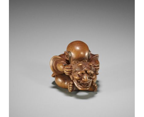 MINKO: A FINE WOOD NETSUKE OF A BOY WITH HANNYA MASKBy Tanaka Juntoku Minko (1735-1816), signed Minko 珉江 with kakihanJapan, T