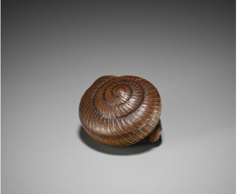 TADAYUKI: A SUPERB WOOD NETSUKE OF A SNAIL RETREATING INTO ITS SHELLBy Tadayuki, signed Tadayuki 忠行Japan, Nagoya, c. 1820-184