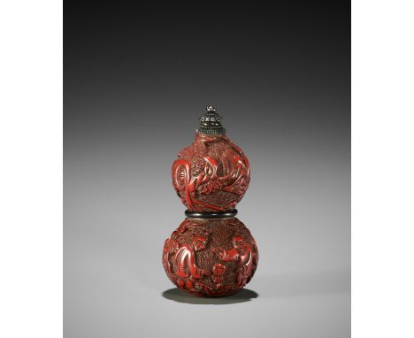 A TSUISHU LACQUER HYOTAN-FORM NETSUKE WITH KEMARI PLAYERSUnsignedJapan, 18th century, Edo period (1615-1868)Finely lacquered 