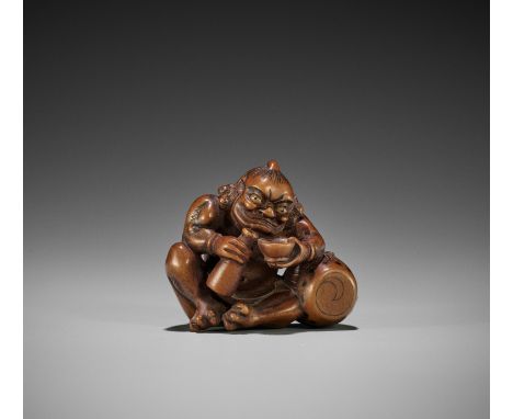 SATO MASAYOSHI: A FINE WOOD NETSUKE OF RAIJIN POURING SAKEBy Sato Masayoshi, signed Masayoshi 正義Japan, Nagoya, mid-19th centu