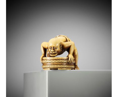 A VERY RARE IVORY NETSUKE OF A MAN WITH A COIN IN HIS MOUTHSigned Okatomo 岡友Japan, late 18th to early 19th century, Edo perio