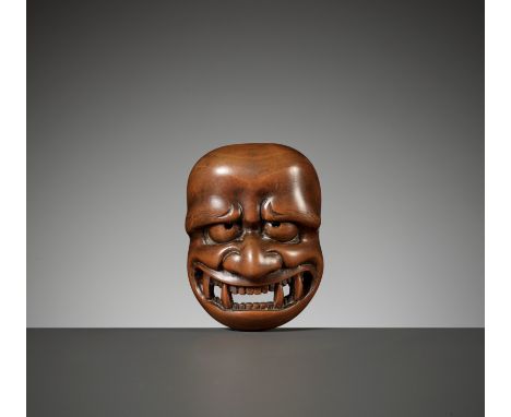 DEME UMAN: A WOOD MASK NETSUKE DEPICTING A DEMONBy Deme Uman, signed Deme Uman 出目右滿Japan, Edo (Tokyo), early 19th century, Ed