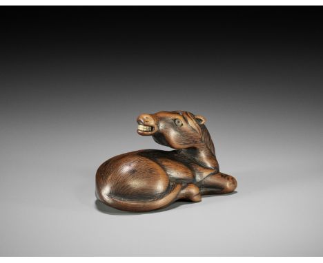 SEIZAN: A RARE WOOD NETSUKE OF A RECUMBENT HORSE  By Seizan, signed Seizan 生山Japan, Nagoya, first half of 19th century, Edo p