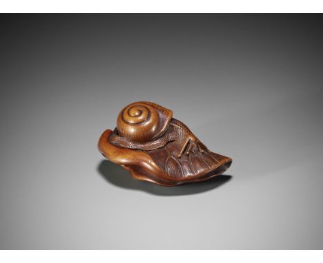 A FINE WOOD NETSUKE OF A SNAIL ON A LOTUS LEAFUnsigned Japan, late 18th to early 19th century, Edo period (1615-1868)Finely c