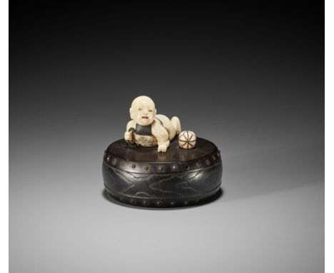 KIKUGAWA: A FINE IVORY AND EBONY NETSUKE OF A KARAKO ON DRUMBy a member of the Kikugawa family, signed Kikugawa 菊川 saku 作Japa