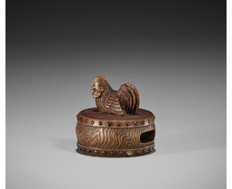 A WOOD NETSUKE OF A COCKEREL ON A WAR DRUMUnsignedJapan, mid-19th century, Edo period (1615-1868)The rooster with carefully i